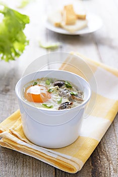 Healthy lunch: baked egg with mashrooms and chive