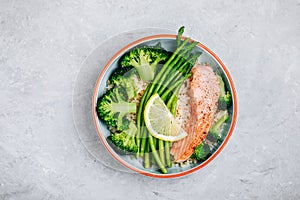 Healthy lunch bowl salmon and broccoli with asparagus and rice