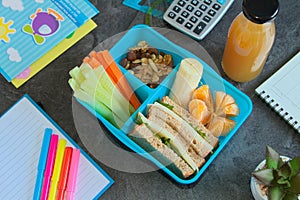 Healthy lunch box for school with raw ingredientds