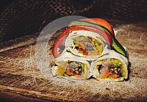 Healthy lunch snack. Stack of mexican street food fajita tortilla wraps with fresh vegetables