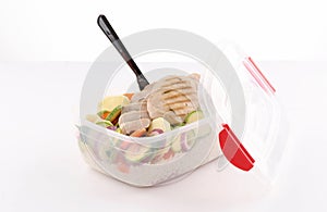 Healthy lunchbox with grilled chicken breast and steamed vegetables photo
