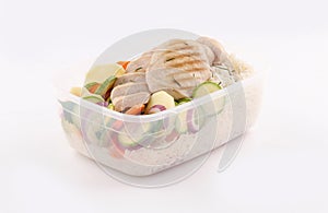 Healthy lunchbox with grilled chicken breast and steamed vegetables photo