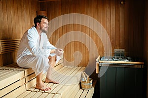 Healthy male in sauna relaxing