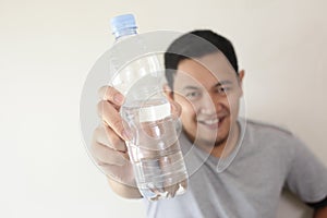 Healthy Man Drink Mineral Water in Bottle