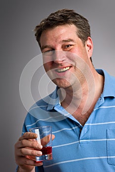 Healthy man drinking cranberry juice