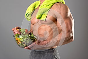 Healthy man eating a salad