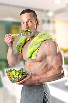 Healthy man eating a salad