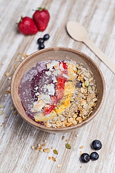 Healthy mango and strawberry dessert with oat and yogurt