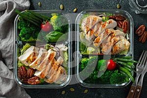 Healthy meal prep containers with green beans, chicken breast and broccoli. A set of food for keto diet in lunchbox on a
