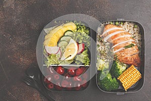 Healthy meal prep containers with grilled chicken with fruits, b