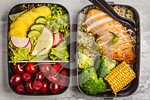 Healthy meal prep containers with grilled chicken with fruits, b