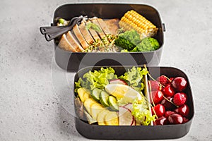 Healthy meal prep containers with grilled chicken with fruits, b