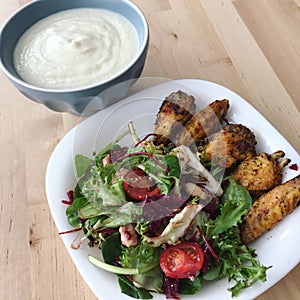 Healthy meal salad and chicken wings photo