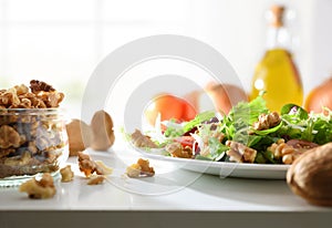 Healthy mediterranean gastronomy with salad with walnuts and olive oil photo