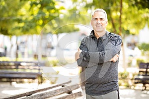 Healthy middle aged man ready for workout in park