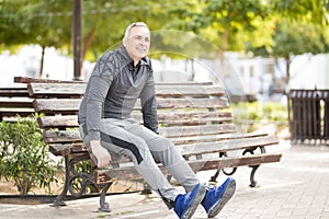 Healthy middle aged man relaxing after workout