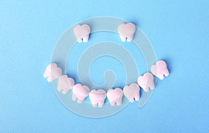 Healthy mouth concept with smile made with toy teeth. Dental background