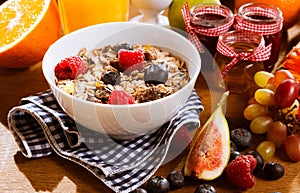 Healthy muesli with fresh berries and fruit photo