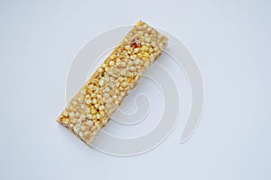 Healthy munchies  on white background. cereal bar on a white background photo