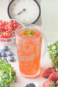 A healthy, non-alcoholic drink made with basil seeds. Currant juice in a transparent glass. Diet food