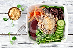 Healthy nourishment bowl on a white wood background