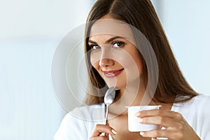 Healthy Nutrition. Beautiful Woman Eating Yogurt, Dairy Product