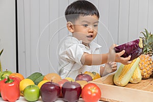 Healthy and nutrition concept. Kid learning about nutrition with doctor to choose eating fresh fruits and vegetables