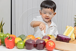 Healthy and nutrition concept. Kid learning about nutrition with doctor to choose eating fresh fruits and vegetables