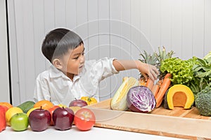 Healthy and nutrition concept. Kid learning about nutrition how to choose eating fresh fruits and vegetables