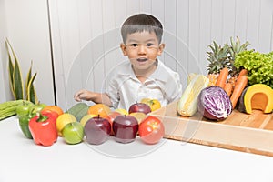 Healthy and nutrition concept. Kid learning about nutrition to choose how to eat fresh fruits and vegetables.