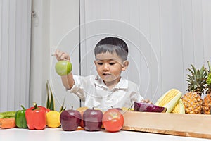 Healthy and nutrition concept. Kid learning about nutrition to choose how to eat fresh fruits and vegetables