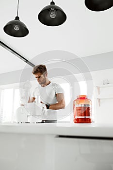 Healthy Nutrition. Man Preparing Protein Shake. Food Supplements