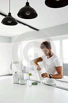 Healthy Nutrition. Man Preparing Protein Shake. Food Supplements