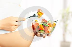 Healthy nutrition and pregnancy. pregnant woman and vegetable sa