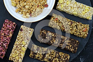 Healthy nutritious snacks. fitness bars on black background