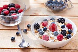 Healthy and nutritious yoghurt with cereal and fresh raw berries