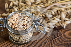 Healthy oat flakes in glass jar