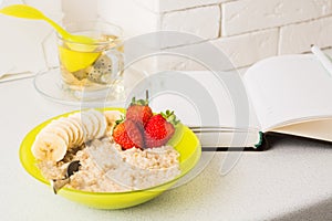 Healthy oatmeal breakfast with fruits and berries, diet plan concept