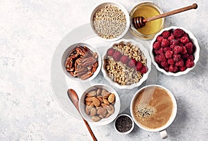 Healthy oatmeal breakfast with raspberries and finns, chia and flax seeds and honey, pattern, top visas, good morning