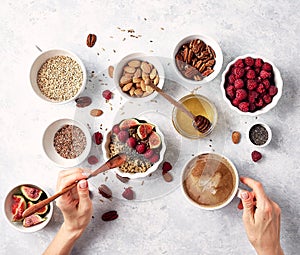 Healthy oatmeal breakfast with raspberries and finns, chia and flax seeds and honey, pattern, top visas, good morning concept