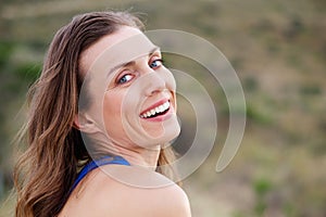 Healthy older woman smiling outside