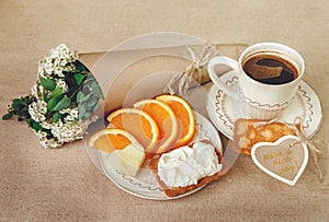 Healthy Organic Breakfast.Cup og Coffee,Cut Orange,Biscuit with Cottage Cheese.Wish Card with Flowers.