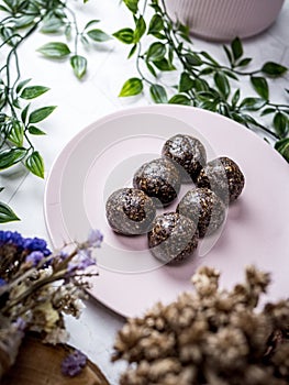 Healthy organic date energy balls with dark chocolate, dried fruits and nuts. Food for healthy lifestyle.