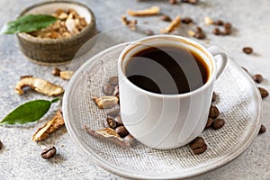 Healthy organic energizing adaptogen, trendy drink. Mushroom coffee in a cup with coffee beans