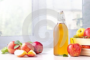 Healthy organic food. Apple cider vinegar in glass bottle.