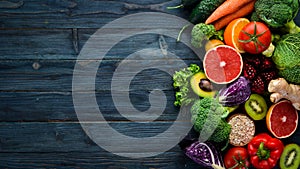 Healthy organic food on a blue wooden background. Vegetables and fruits.