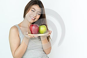 Healthy organic food for dieting woman concept. Woman carry green apple.