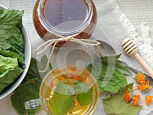 Healthy organic herbal tea with calendula and dry leaves of blackcurrant and mulberry.