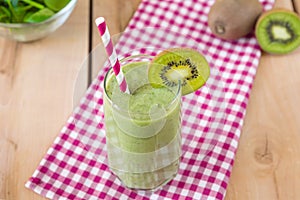 Healthy organic smoothie on the wooden background