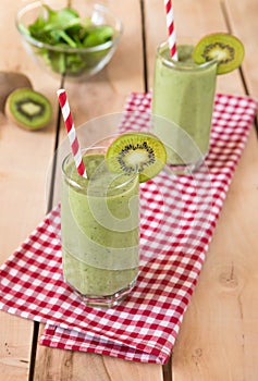 Healthy organic smoothie on the wooden background